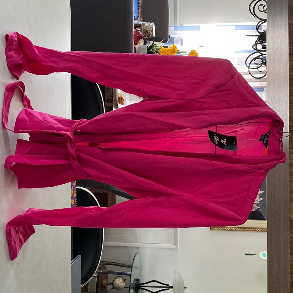 Pink belted blazer in silk type material.